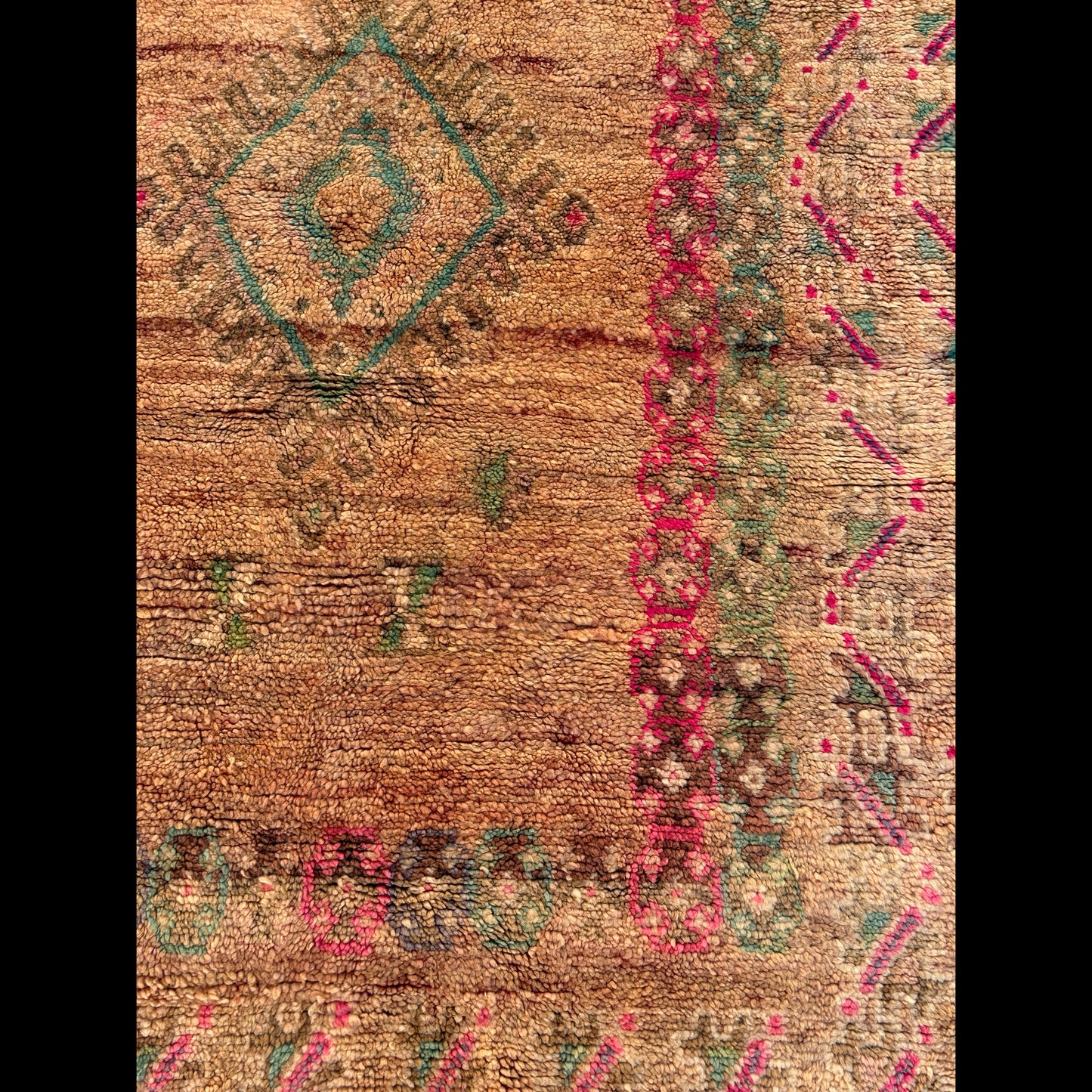 Close-up of the frame showing the shift from magenta and teal to purple and light brown, featuring tiny inset diamonds.