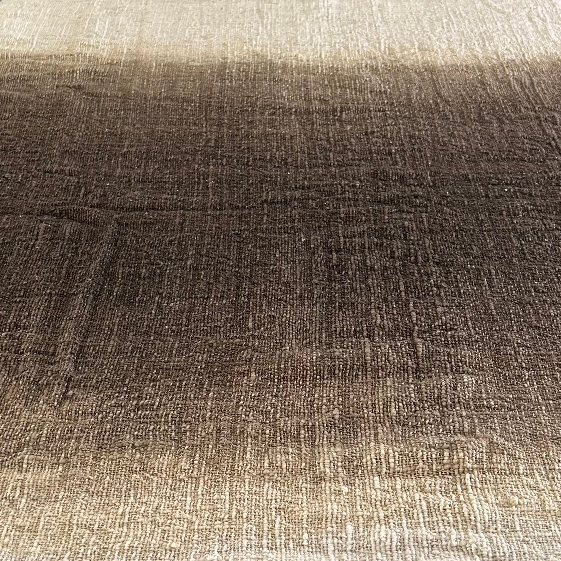 Textured fabric of the Espresso Throw shown laying flat with a graduation from neutral to espresso and back to neutral.