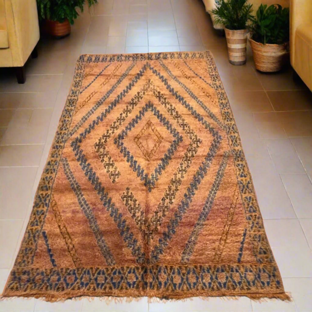 A rare and soulful vintage Moroccan Beni M'Guild rug featuring rich, weathered rust tones and striking navy blue diamond highlights, 3.2m x 2.0m.