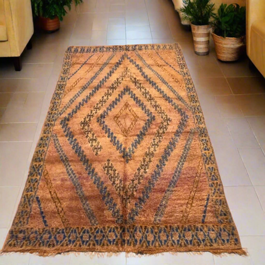 A rare and soulful vintage Moroccan Beni M'Guild rug featuring rich, weathered rust tones and striking navy blue diamond highlights, 3.2m x 2.0m.