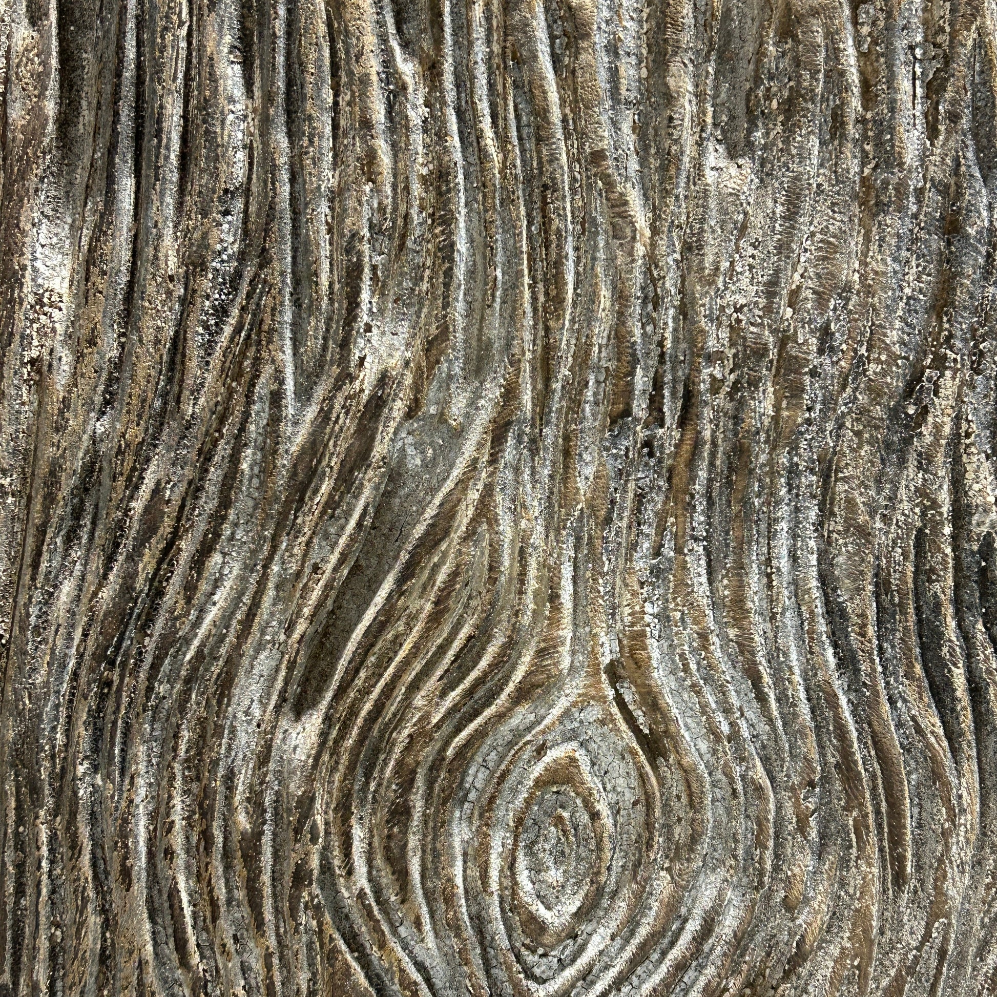 Close-up of carved timber surface with concentric circular patterns