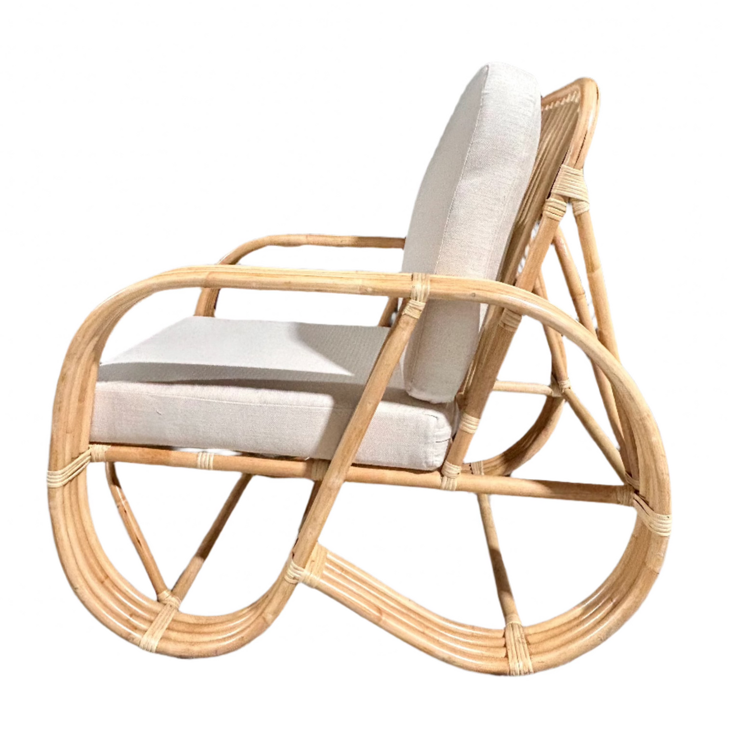 Side profile of the Slingback Rattan Chair against a white background
