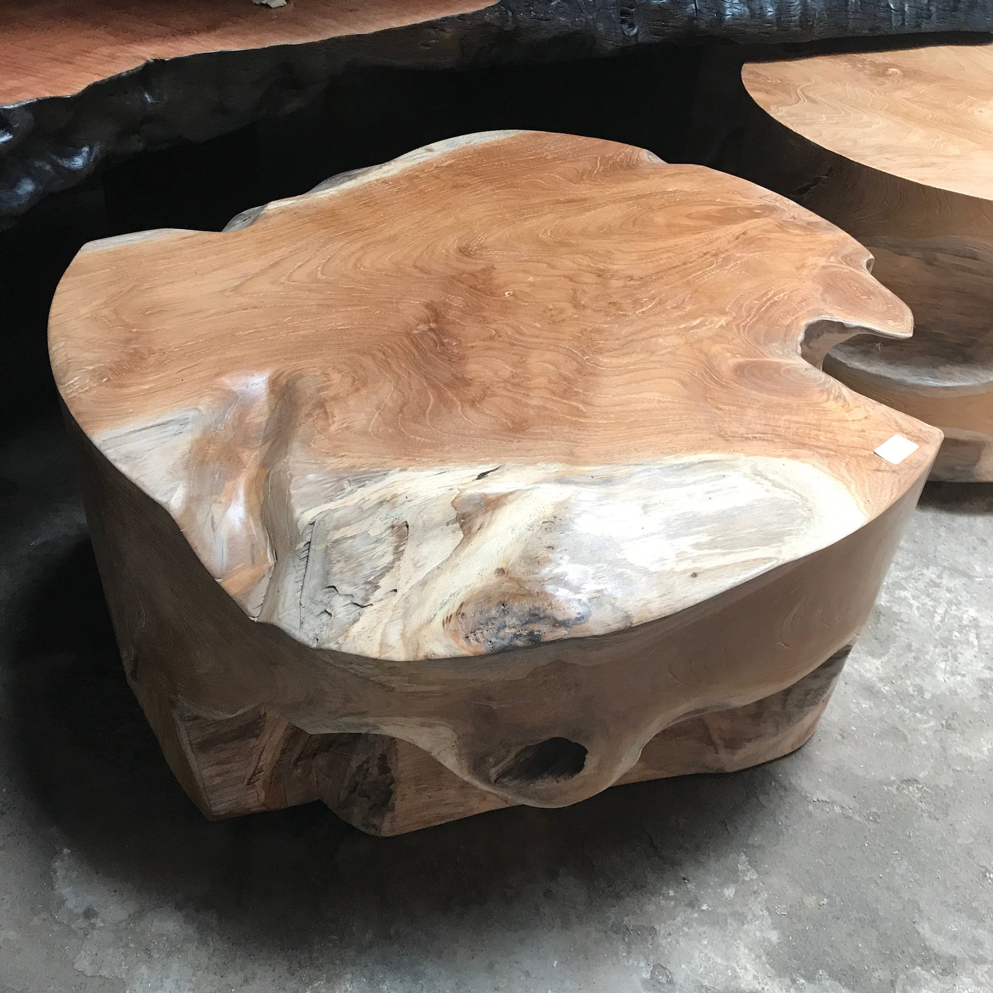 Timber side table showing wood grain and colour variants from honey tones to pale grey.