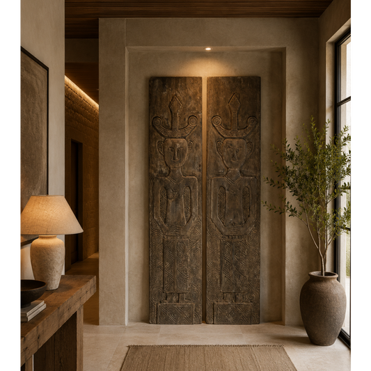 Pair of hand-carved timber tribal wall panels, known as The Kinship Panels, depicting husband and wife figures with intricate geometric and spiral carvings, ideal for statement foyer or commercial interiors.