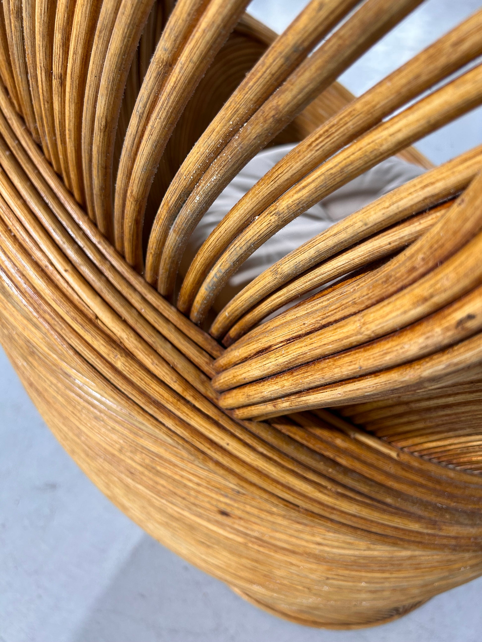Closeup image of the Petali Chair showing top down view of woven rattan.