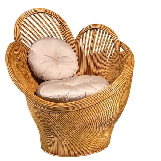 A rattan chair with a unique heart-like shape, featuring cushions and a light brown color.