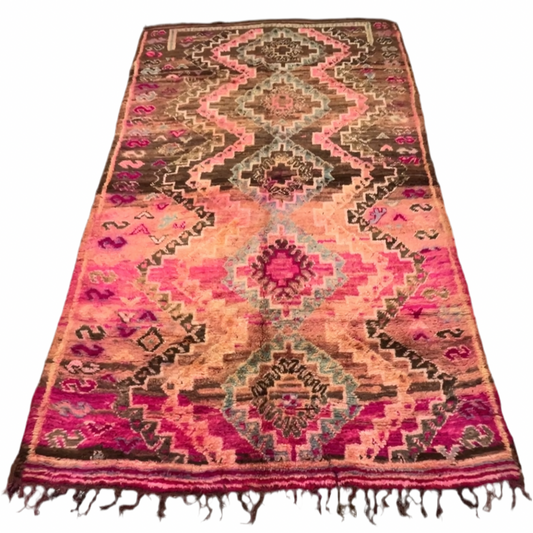 Top-down view of the Boujaad rug showing the symmetrical zigzag path running vertically through the center of the brown and magenta field.