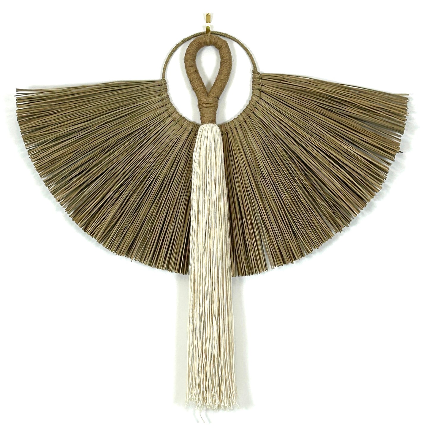 White cotton and jute handle tassel wall hanging, shown with a grass wall hanging against a white wall.