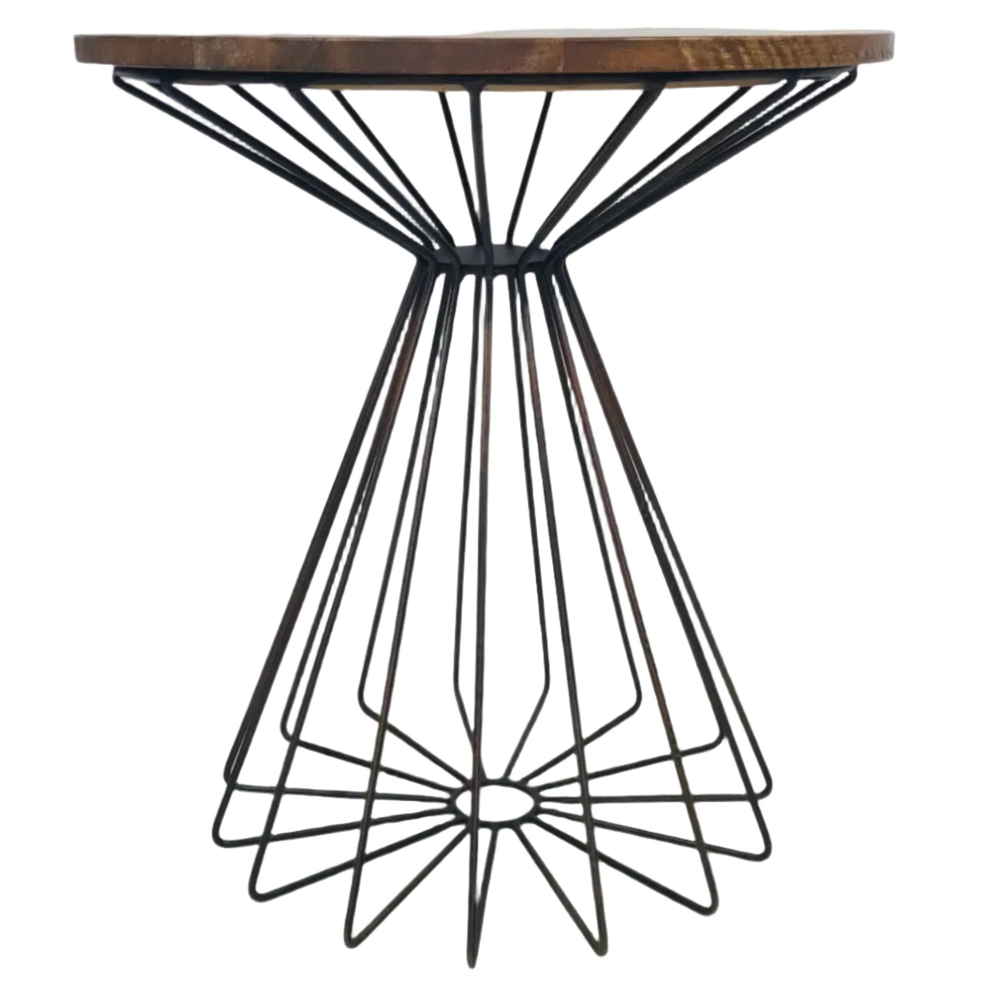 Frontal image of a small round table with a wooden top and metal geometric base on a white background