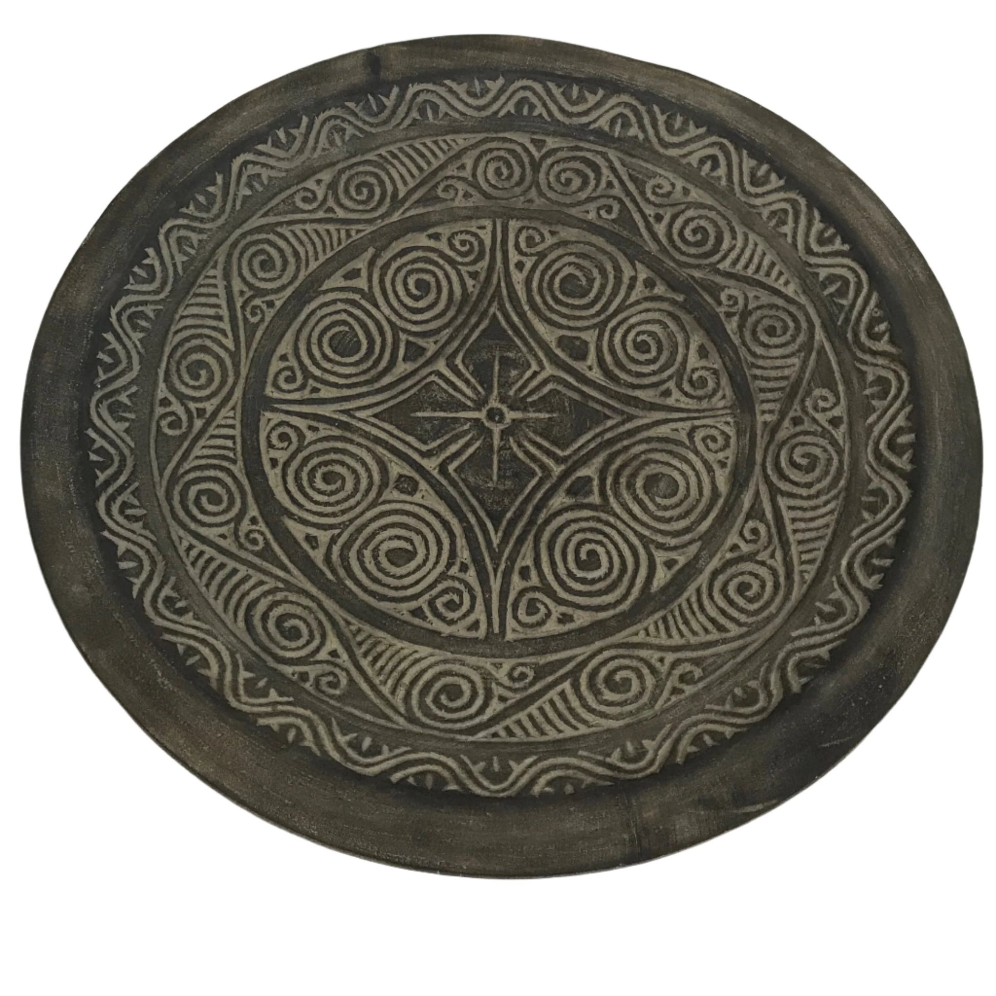 Handcrafted shallow brown bowl with intricate carved detailing and earthy tones, perfect for styling or display.