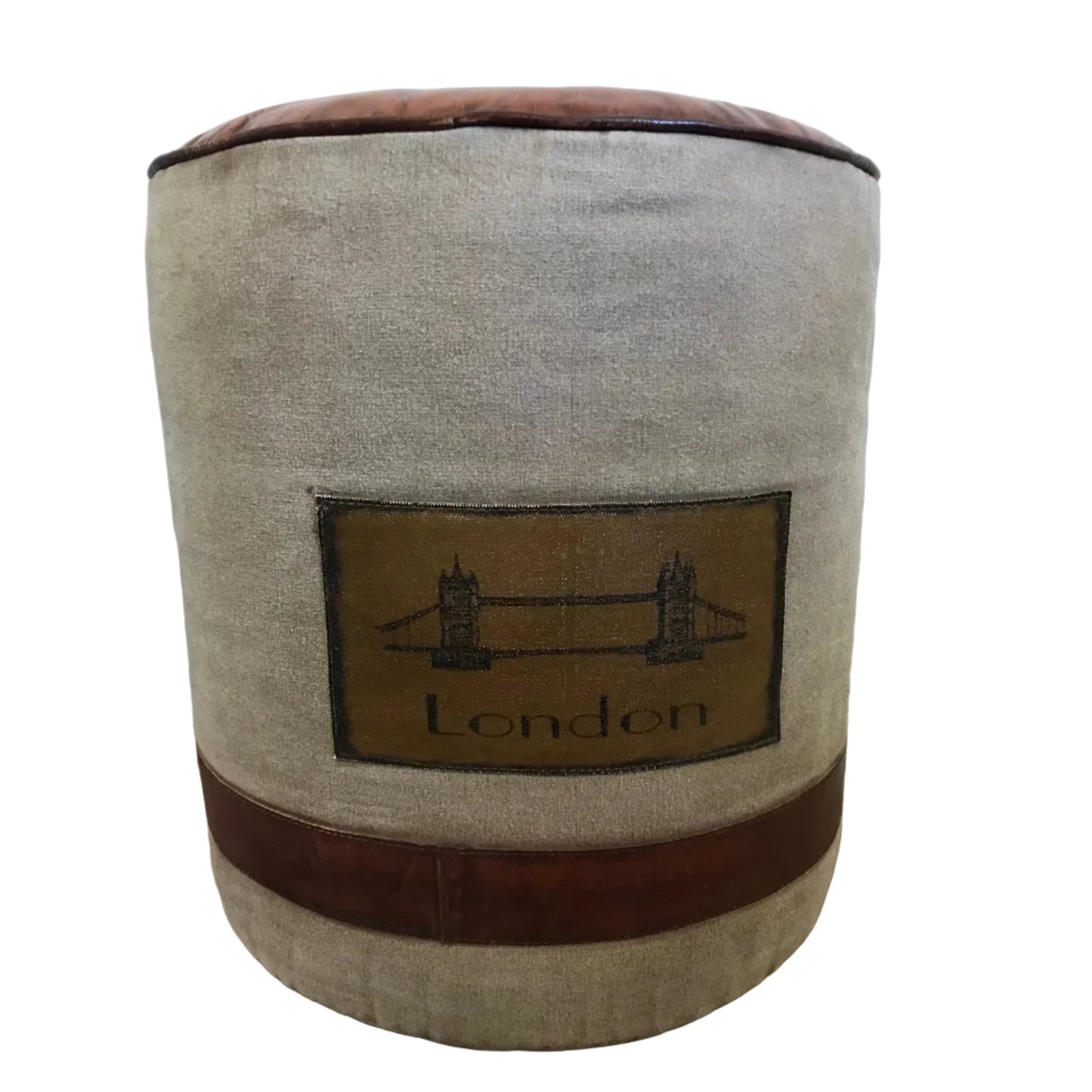 Off white canvas and leather look top ottoman with a stitched panel on the front that says London, showing the London bridge.