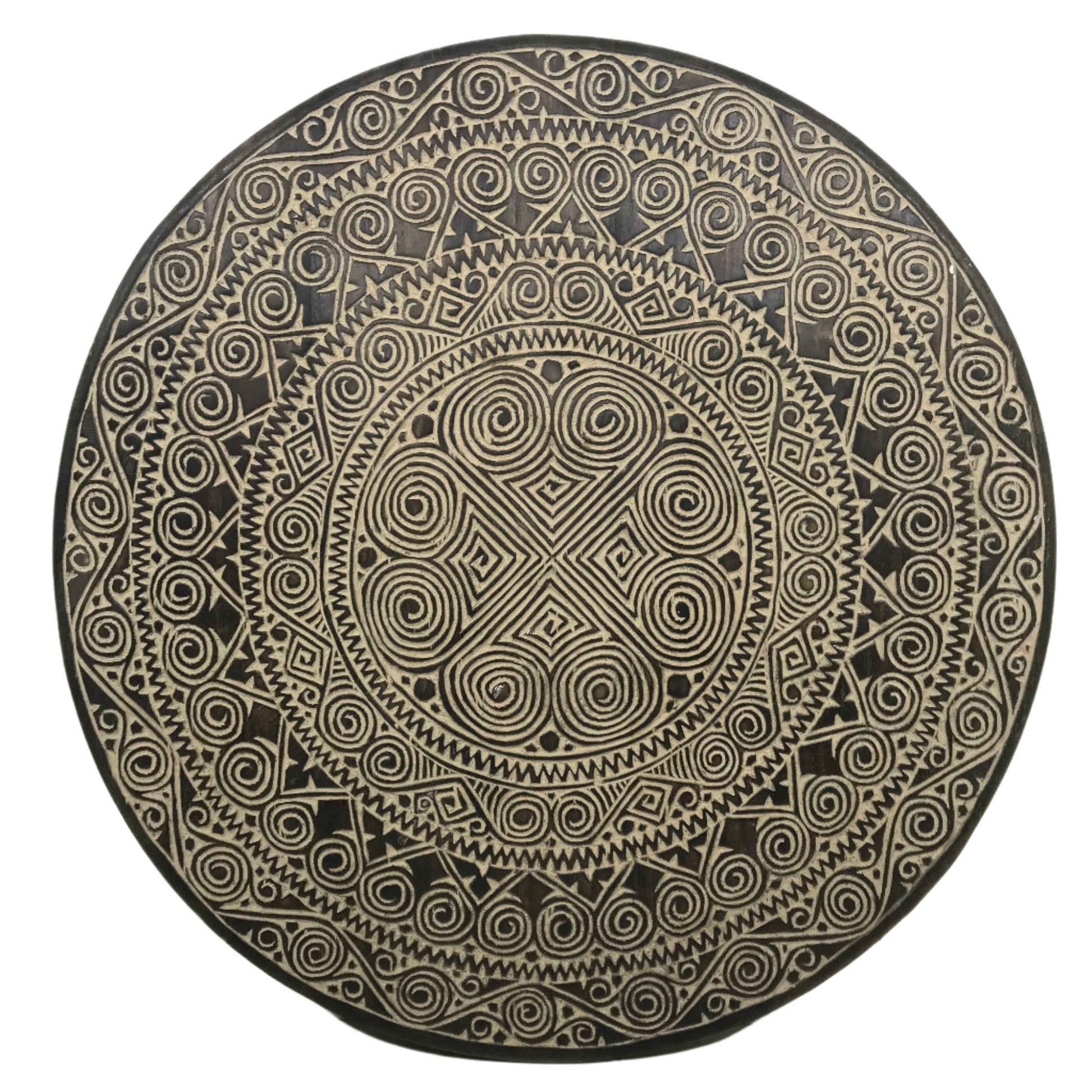 Circular 90cm hand-carved timber wall disc with ebony stained background, featuring Toraja-inspired concentric mandala of spiral pa'barre allo motifs, zigzag sunburst and diamond cross-hatch patterns, Bali.