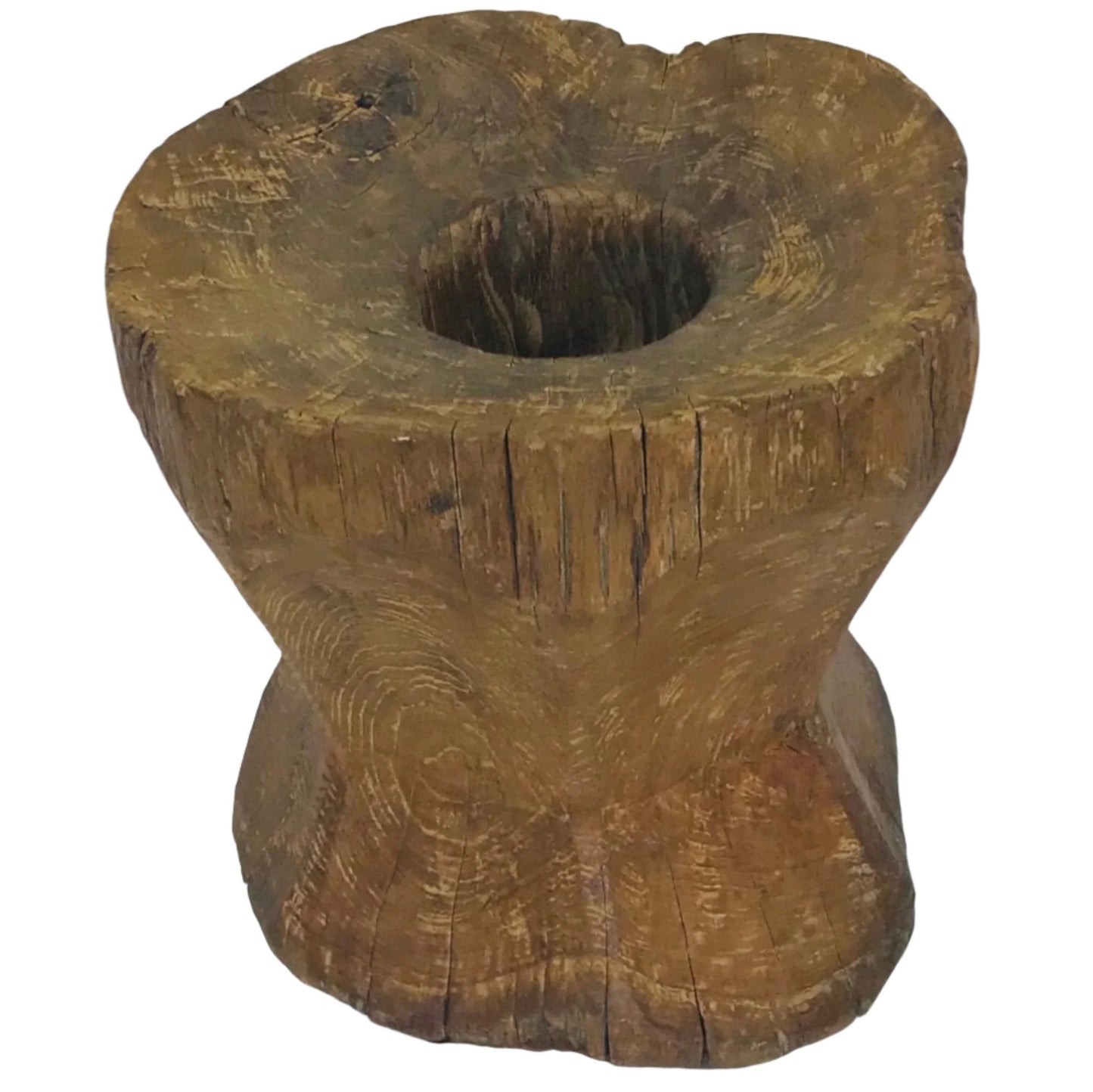 Hand-carved vintage Indonesian teak wood grinder with weathered texture and natural grain.