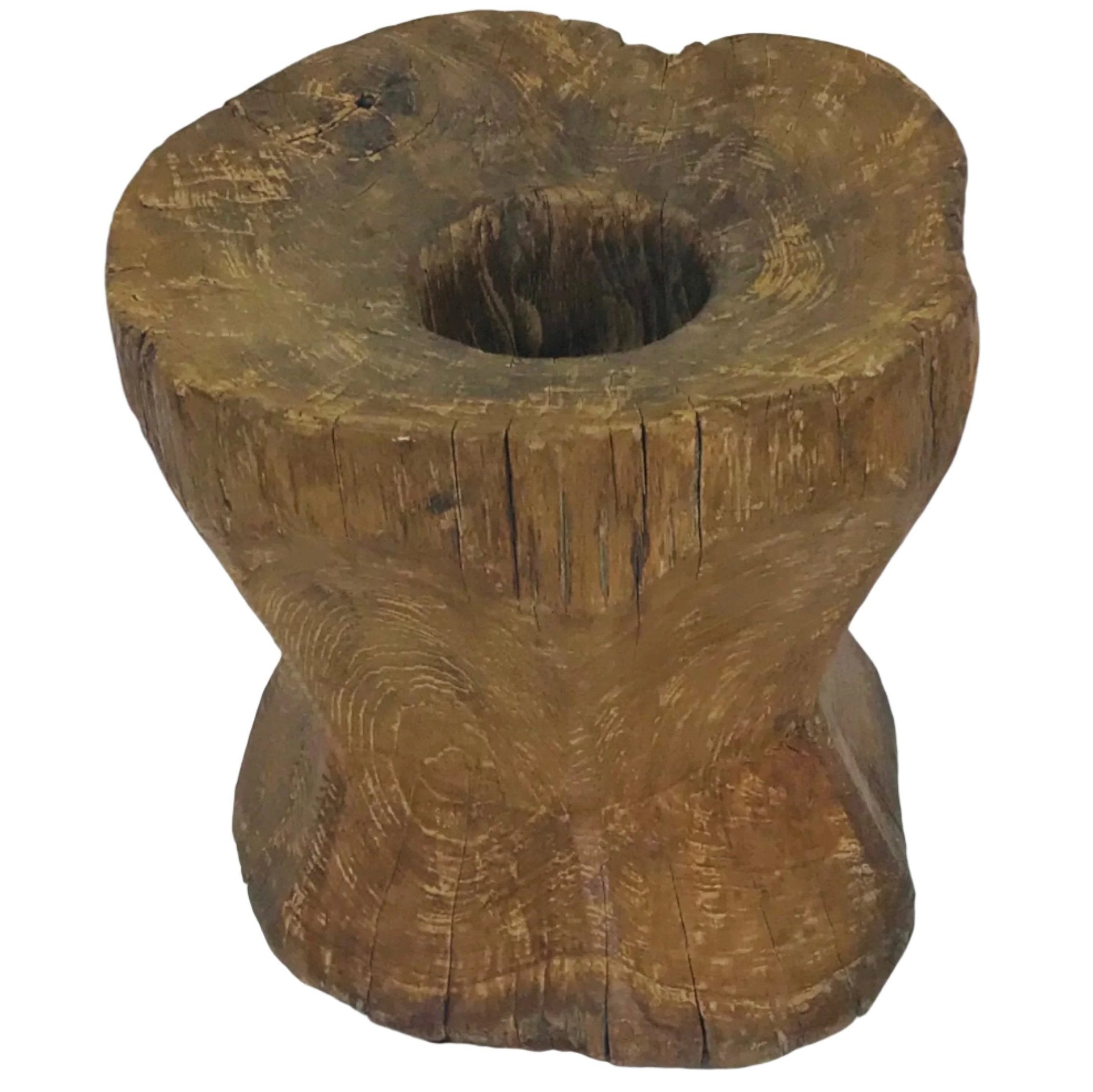 Hand-carved vintage Indonesian teak wood grinder with weathered texture and natural grain.